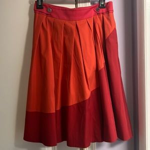 Karen Millen skirt falls Just below the knee, full skirt with box pleats